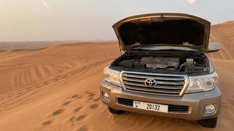 Landcruiser in the Desert with the Hood open for cooling the engine